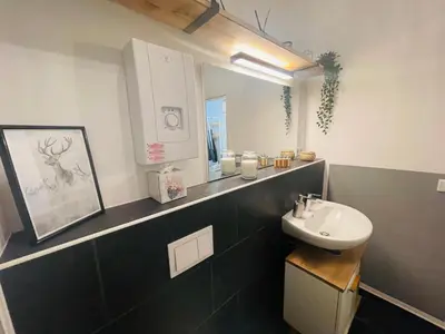 Ein Badezimmer in der Unterkunft modern * gemütlich * Nespresso * Terrasse * Netflix