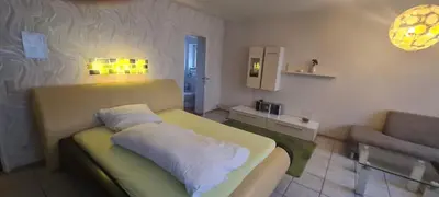 Ein Sitzbereich in der Unterkunft Hotel Zur Aue