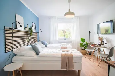 Ein Bett oder Betten in einem Zimmer der Unterkunft HOMEFY - Studio Heaven