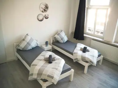 Ein Bett oder Betten in einem Zimmer der Unterkunft City Wohnung Zentral 89-10