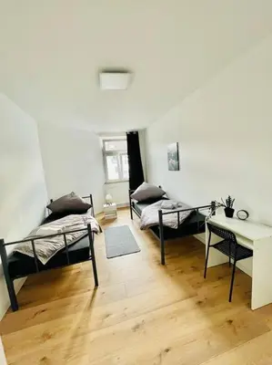 Ein Bett oder Betten in einem Zimmer der Unterkunft City Wohnung Zentral 85-5