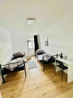 Ein Bett oder Betten in einem Zimmer der Unterkunft City Wohnung Zentral 85-5