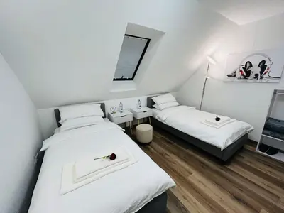 Ein Bett oder Betten in einem Zimmer der Unterkunft Messe HV-2