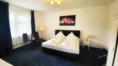 Ein Bett oder Betten in einem Zimmer der Unterkunft Hotel 9-enhof