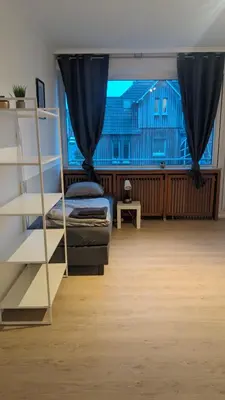 Ein Sitzbereich in der Unterkunft Monteur-Ferien-Messewohnung Mettmann 6 Personen 2 OG