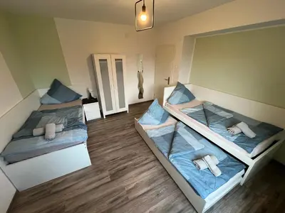 Ein Bett oder Betten in einem Zimmer der Unterkunft Pluto