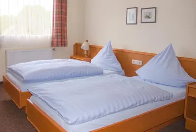 Ein Bett oder Betten in einem Zimmer der Unterkunft Einhaus Jägerhof