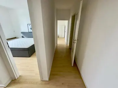Ein Bett oder Betten in einem Zimmer der Unterkunft Exklusiver Rheinblick Messe Parken 5 Zimmer, 12 Personen