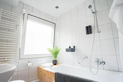 Ein Badezimmer in der Unterkunft HOMEFY - Holiday Apartment