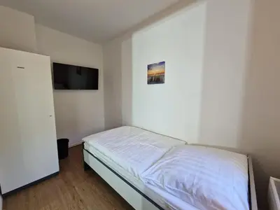 Ein Bett oder Betten in einem Zimmer der Unterkunft Meribu L92 Wohnung für Monteure und Arbeiter