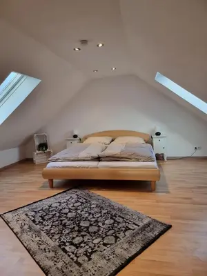 Ein Bett oder Betten in einem Zimmer der Unterkunft FeWo Sundernblick
