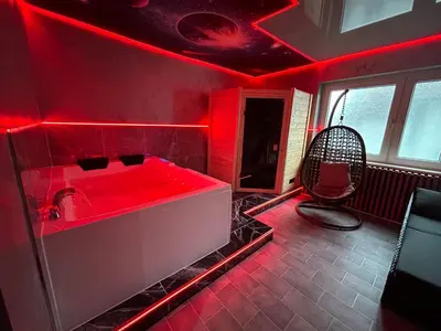 Ein Bett oder Betten in einem Zimmer der Unterkunft Wellness Suite mit Whirlpool & Sauna