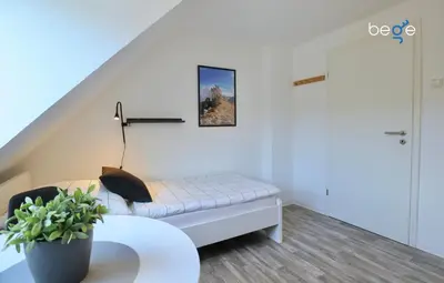 Ein Bett oder Betten in einem Zimmer der Unterkunft BEGE APARTMENTS: BUSINESS QUARTERS