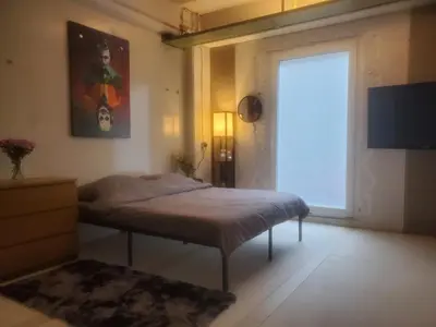 Ein Bett oder Betten in einem Zimmer der Unterkunft SPA industrial Loft im ehemaligen Umspannwerk Schaltzentrale