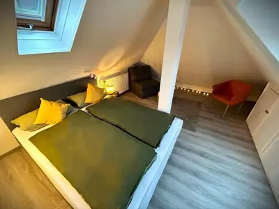 Ein Bett oder Betten in einem Zimmer der Unterkunft gemütliche 3 Zi Wohnung & Garage Essen Messe