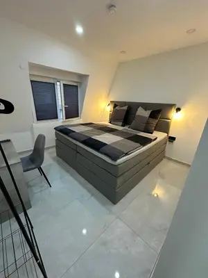 Ein Bett oder Betten in einem Zimmer der Unterkunft Moparts