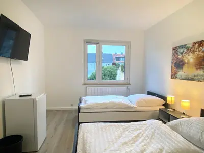Ein Bett oder Betten in einem Zimmer der Unterkunft Meribu E1 Wohnung für Monteure und Arbeiter
