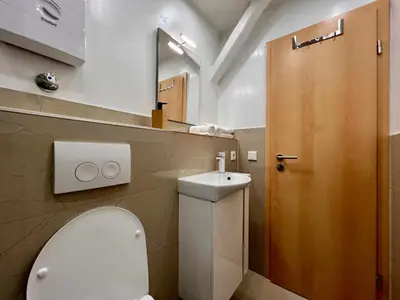 Ein Badezimmer in der Unterkunft PrimeTime Suite für 2 mit Küche