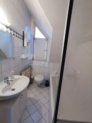 Ein Badezimmer in der Unterkunft Helle Maisonnette Wohnung Penthouse