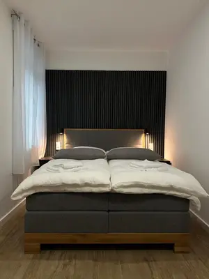 Ein Bett oder Betten in einem Zimmer der Unterkunft TOKA ROOMS - an der Regiobahn