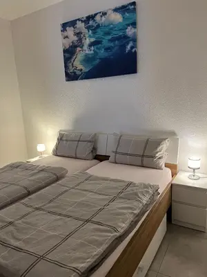 Ein Bett oder Betten in einem Zimmer der Unterkunft Ferienwohnung