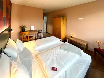 Ein Bett oder Betten in einem Zimmer der Unterkunft Kloster-Quartier