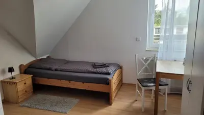 Ein Bett oder Betten in einem Zimmer der Unterkunft Ferienwohnung Gästehaus Bauer 2