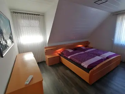 Ein Bett oder Betten in einem Zimmer der Unterkunft Ferienwohnung 