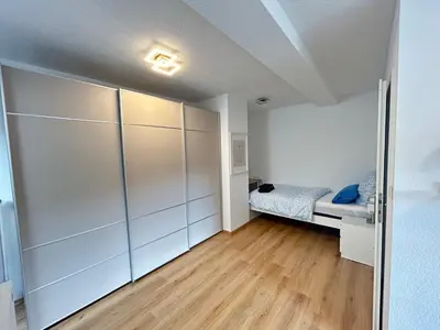 Ein Bett oder Betten in einem Zimmer der Unterkunft FeWo & Monteurwohnungen 2