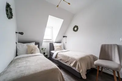 Ein Bett oder Betten in einem Zimmer der Unterkunft Im Stadtzentrum / Küche / Für 5