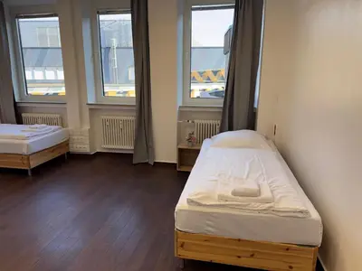 Ein Bett oder Betten in einem Zimmer der Unterkunft T&K Apartments - 2 - 5 Room Apartments - Heart of Solingen-Hofgarten