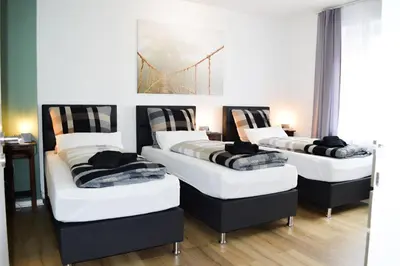 Ein Bett oder Betten in einem Zimmer der Unterkunft Centerapartments Marienstrasse