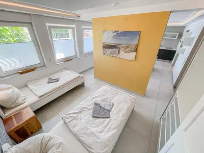Ein Bett oder Betten in einem Zimmer der Unterkunft Ferienwohnung Fiete mit eigenem Eingang
