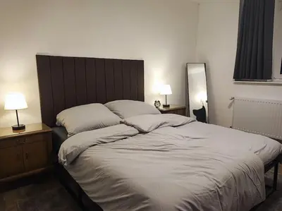 Ein Bett oder Betten in einem Zimmer der Unterkunft Elegantes 3-Schlafzimmer-Nest