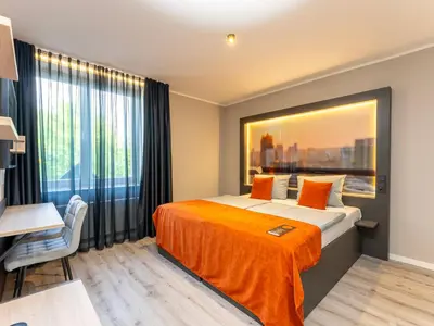 Ein Bett oder Betten in einem Zimmer der Unterkunft JustStay Essen Hotel & Apartments