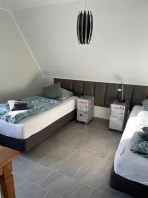 Ein Bett oder Betten in einem Zimmer der Unterkunft WorkersHome