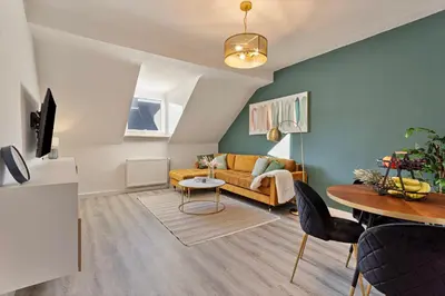 Ein Sitzbereich in der Unterkunft Zeche trifft Villa Apartments by Cordis Sky für bis zu 4 Personen 5 Minuten zur Messe Essen oder Hauptbahnhof