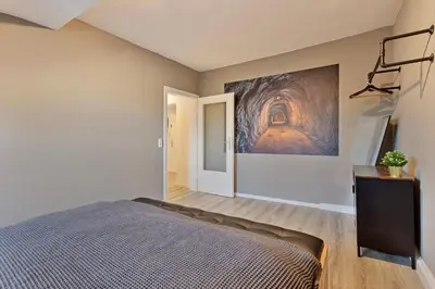 Ein Bett oder Betten in einem Zimmer der Unterkunft Zeche trifft Villa Apartments by Cordis Sky für bis zu 4 Personen 5 Minuten zur Messe Essen oder Hauptbahnhof