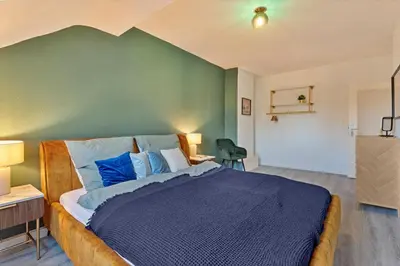 Ein Bett oder Betten in einem Zimmer der Unterkunft Zeche trifft Villa Apartments by Cordis Sky für bis zu 4 Personen 5 Minuten zur Messe Essen oder Hauptbahnhof