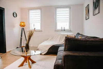 Ein Sitzbereich in der Unterkunft Modern & black - City - Netflix - Wifi - 4 Person