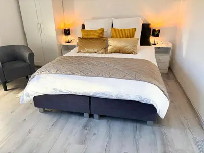 Ein Bett oder Betten in einem Zimmer der Unterkunft Hübsches Cottage in ehemaliger Gärtnerei