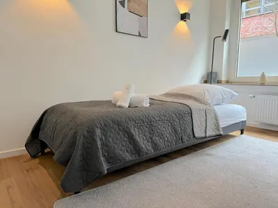 Ein Bett oder Betten in einem Zimmer der Unterkunft MODERN & MINIMAL - Design-Apartment in Stadtmitte