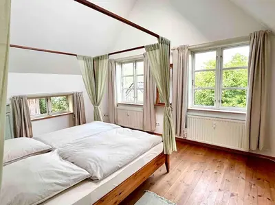 Ein Bett oder Betten in einem Zimmer der Unterkunft Fachwerkhaus am Waldesrand