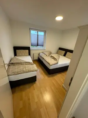 Ein Bett oder Betten in einem Zimmer der Unterkunft Alex Apartment's 2