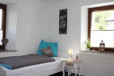 Ein Bett oder Betten in einem Zimmer der Unterkunft exklusive Ferienwohnung