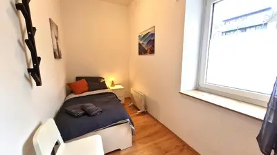Ein Bett oder Betten in einem Zimmer der Unterkunft Modernes Apartment für 5 Personen