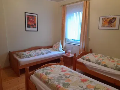 Ein Bett oder Betten in einem Zimmer der Unterkunft Ferienwohnung Bottrop Radetzki