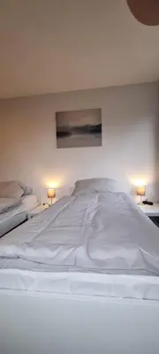 Ein Bett oder Betten in einem Zimmer der Unterkunft 3-Bett Wohnung im Boardinghaus Elisabeth