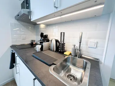 Küche/Küchenzeile in der Unterkunft Vibehome Düsseldorf - Stadtmitte