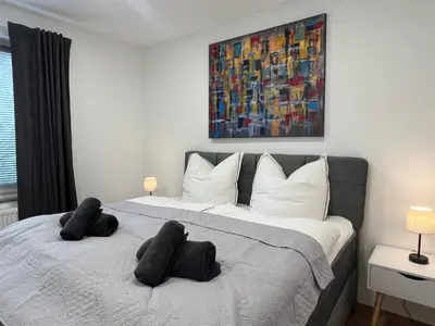 Ein Bett oder Betten in einem Zimmer der Unterkunft RUEHOME